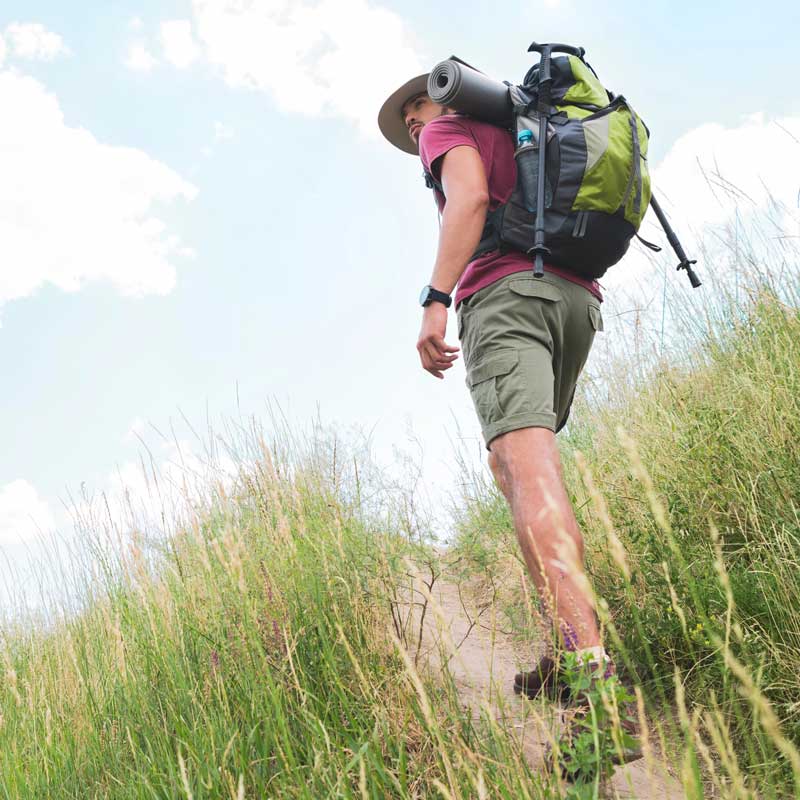 a man hikes on a trail